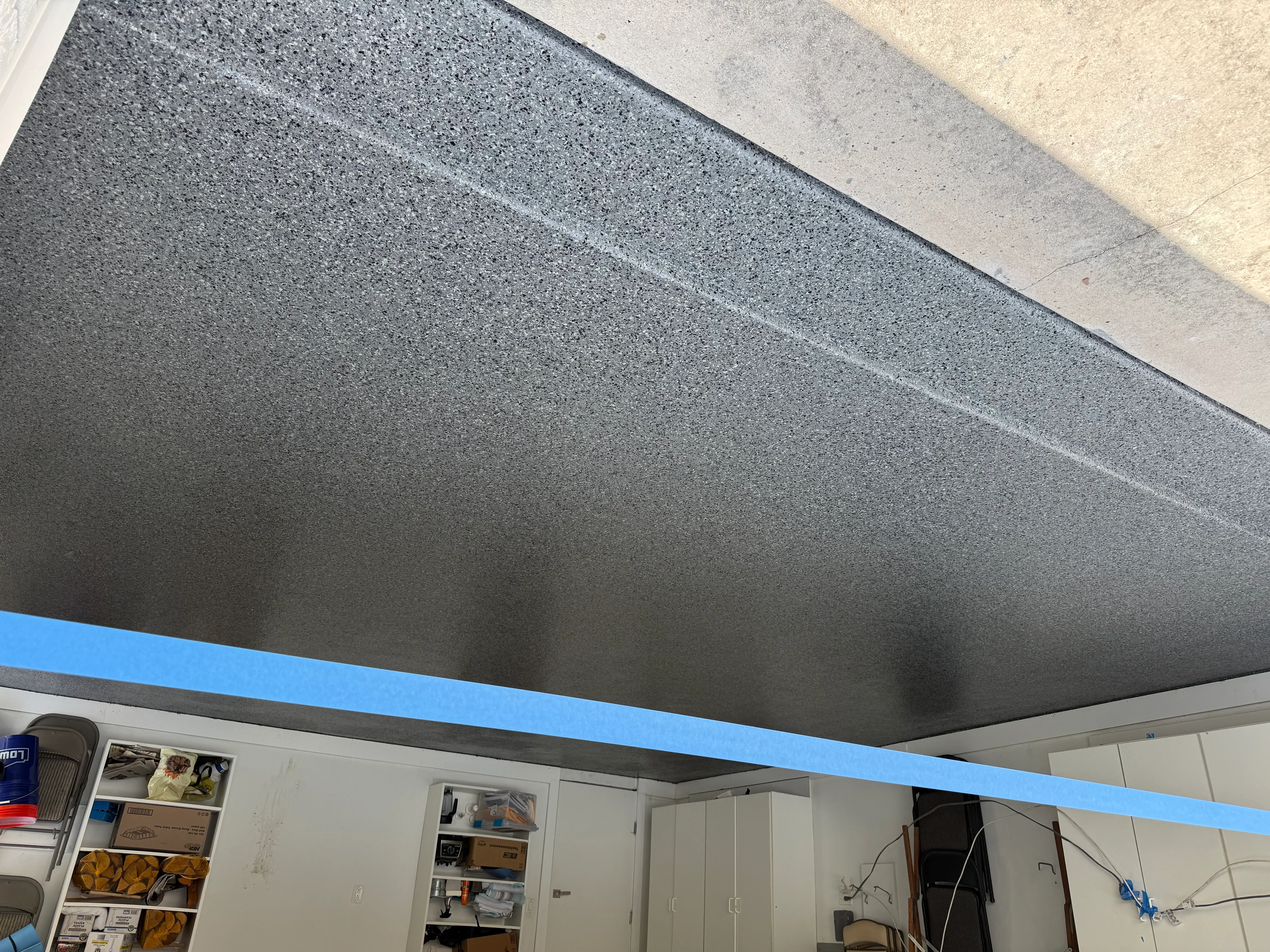 Gray textured concrete ceiling with smooth aggregate finish and clean edge detail