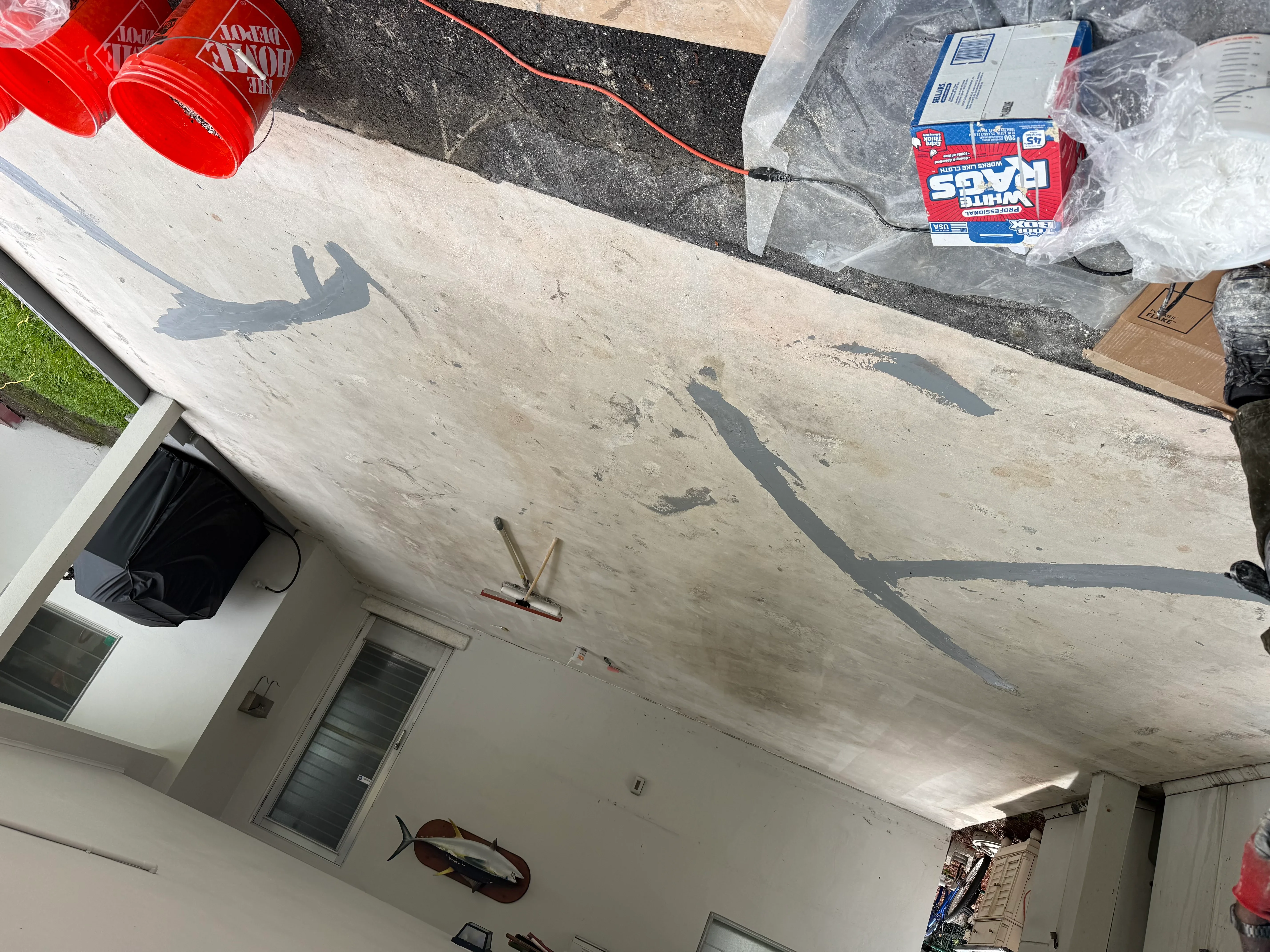 Concrete ceiling with patched repairs and finished concrete surface work